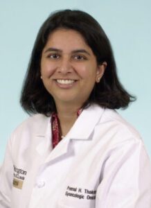 Premal Thaker, MD interviewed on uterine cancer shown in profile image wearing white lab coat.