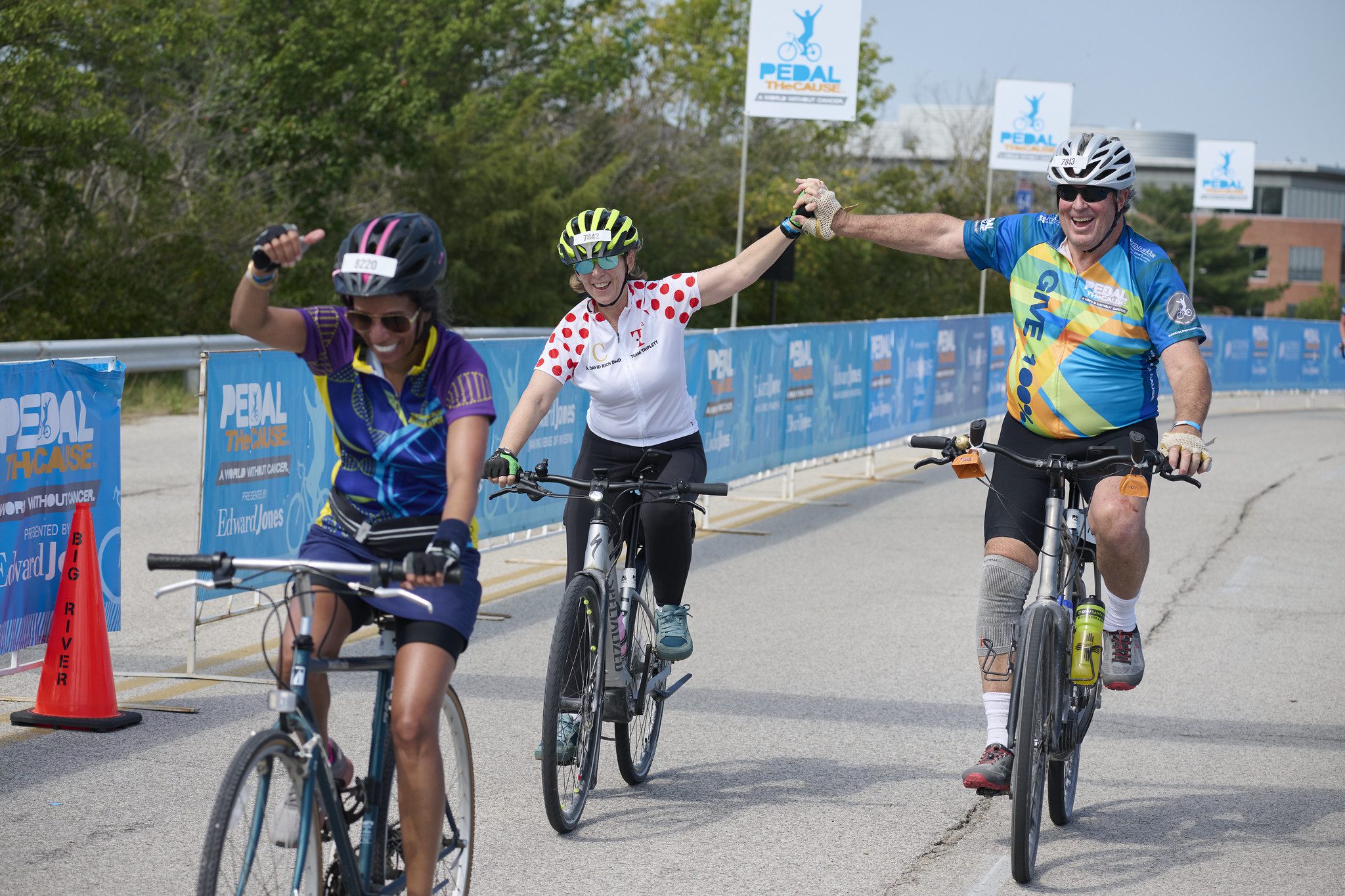 Three bicyclists participate in charity race