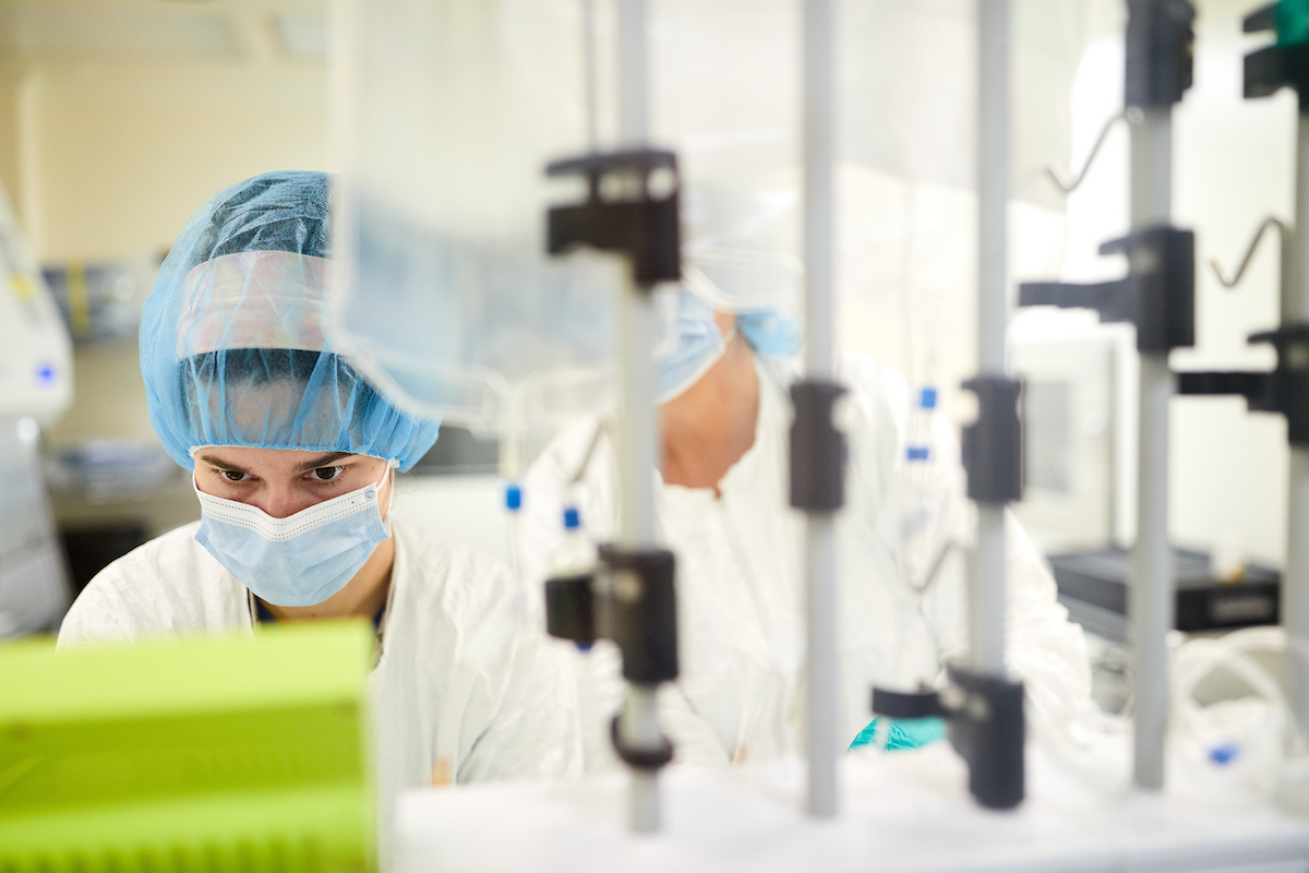 Research lab manager Julie Ritchey manufactures cells in the current Good Manufacturing Practice (cGMP) lab at WashU Medicine and Siteman Cancer Center