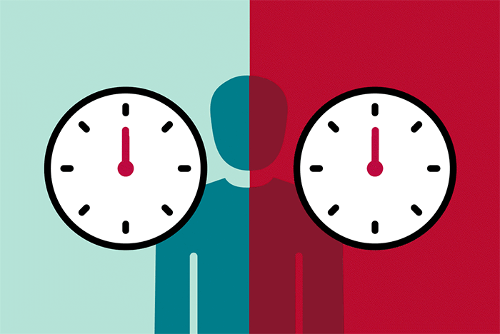 The gif shows two clocks, with the red clock on the right ticking by faster than the green clock on the left to depict faster biological aging.