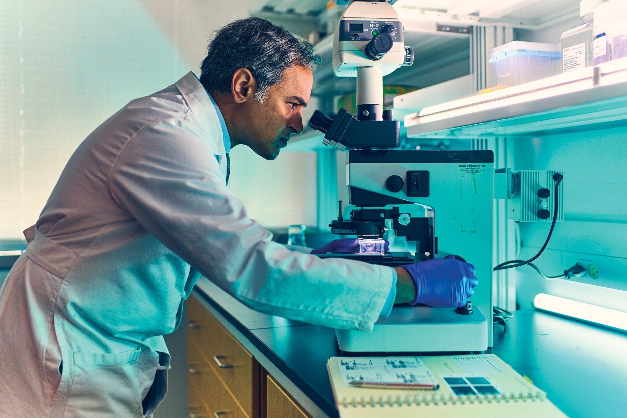 WashU physician-researcher Milan G. Chheda, MD, works in a research lab.